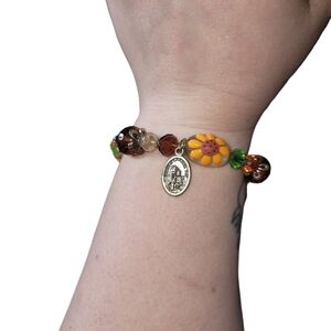 Yellow and Brown Beaded Bracelet with Metallic Charm